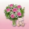arreglo de rosas rosadas con peluche
